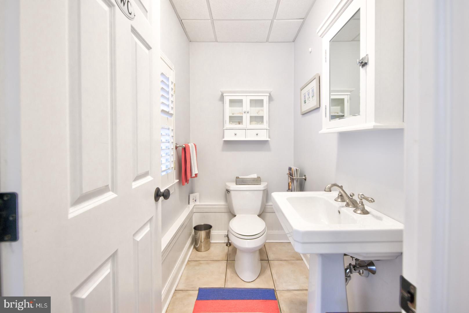 228 South Fairfield Road Devon, PA 19333 - Photo 30 of 61 a bathroom with a sink and mirror with toilet