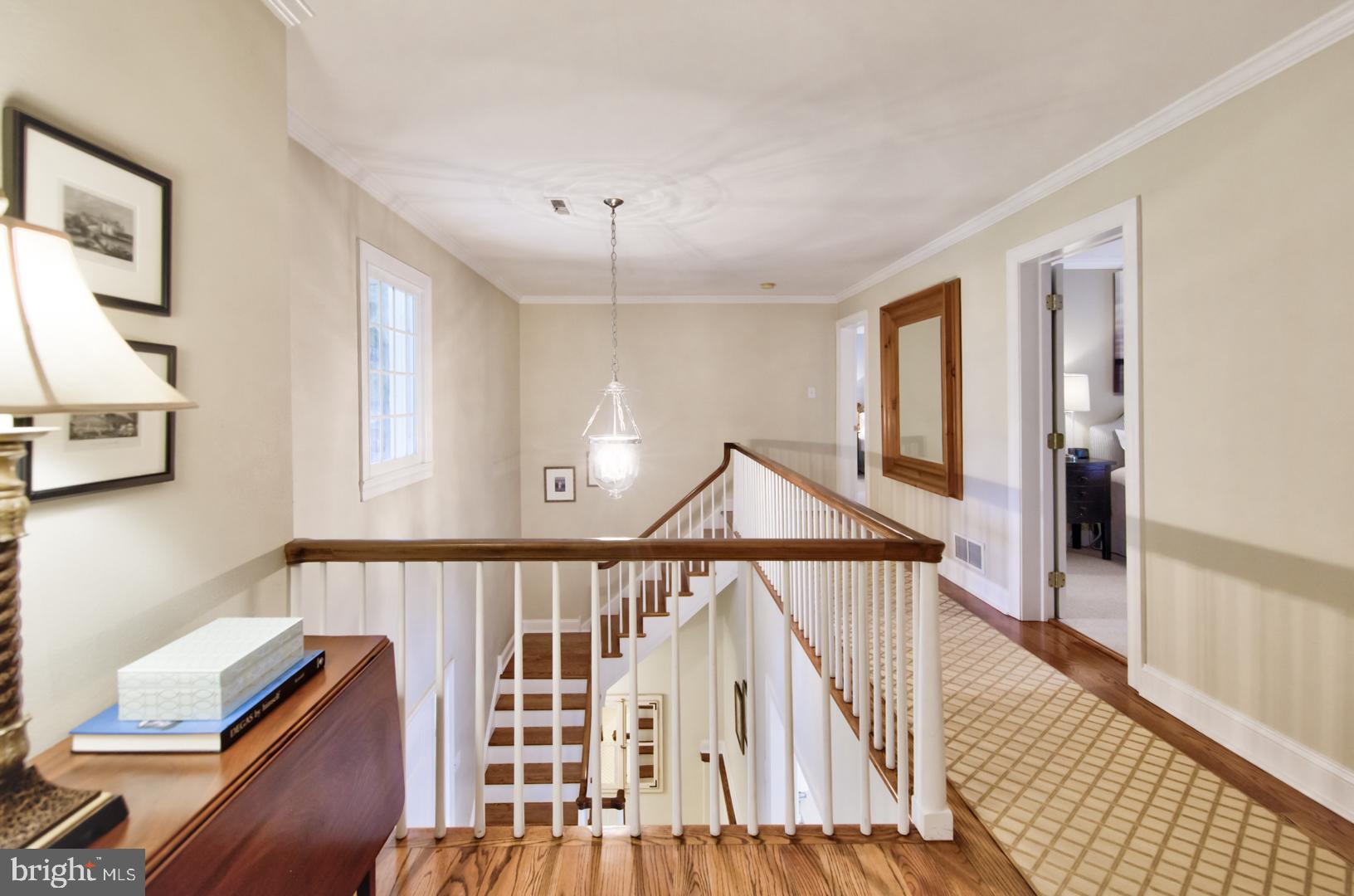 228 South Fairfield Road Devon, PA 19333 - Photo 43 of 61 a view of a hallway with wooden floor and staircase