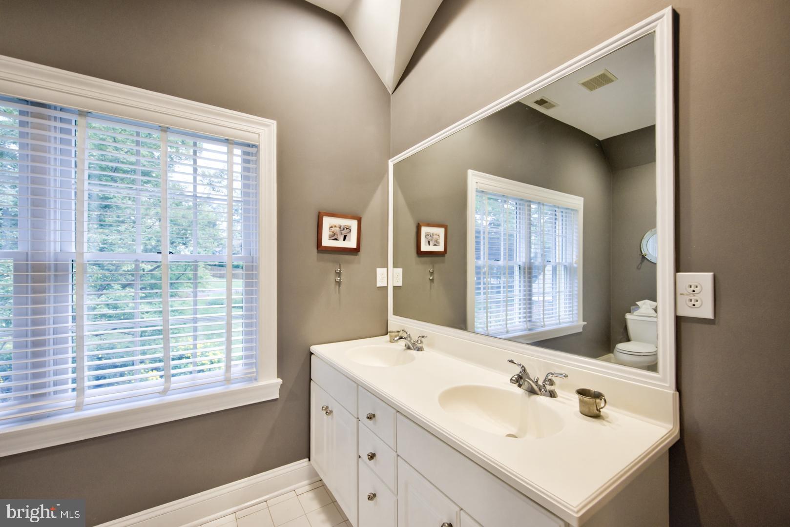228 South Fairfield Road Devon, PA 19333 - Photo 46 of 61 a bathroom with a sink double vanity and a mirror