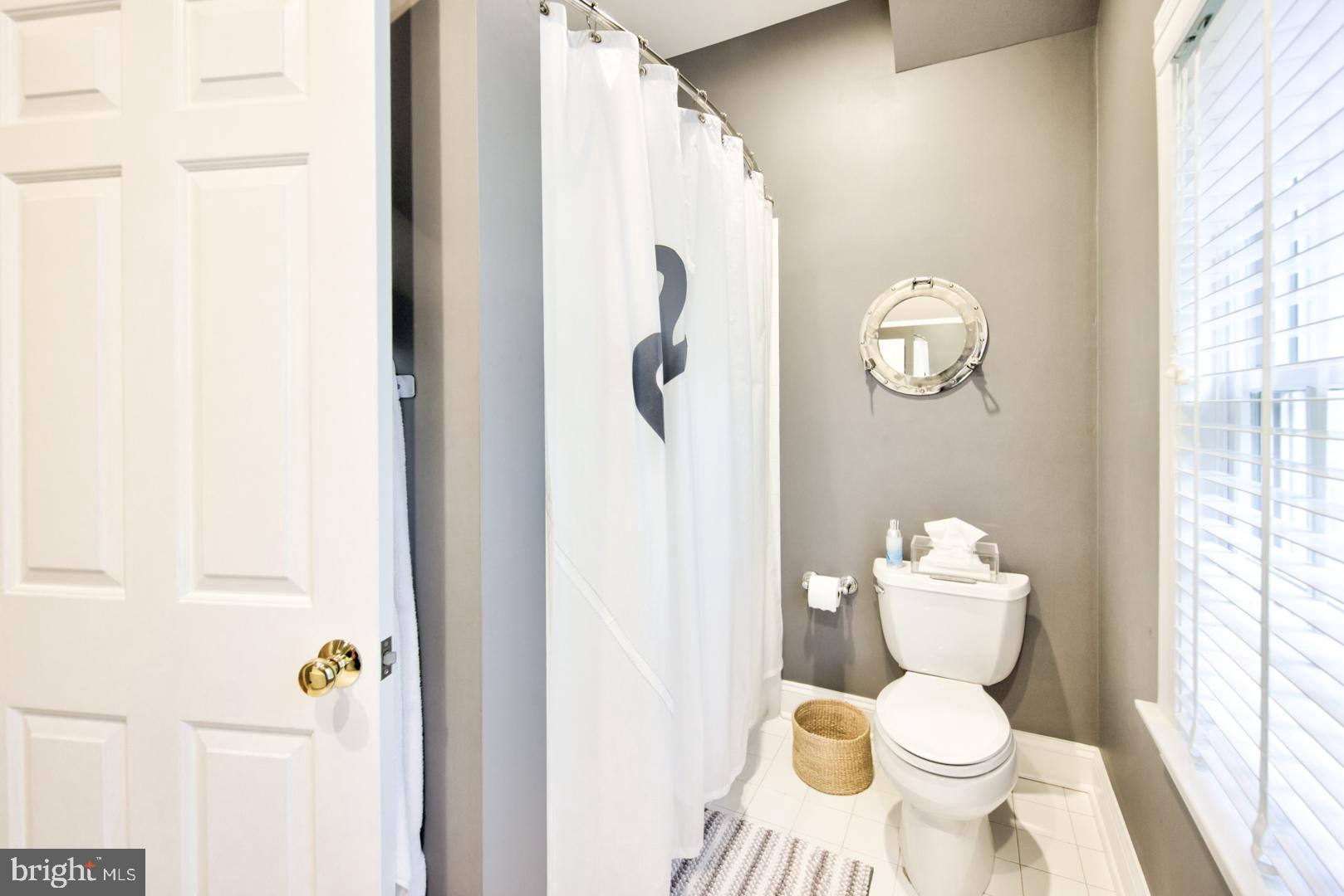 228 South Fairfield Road Devon, PA 19333 - Photo 47 of 61 a white toilet sitting next to a bathroom sink