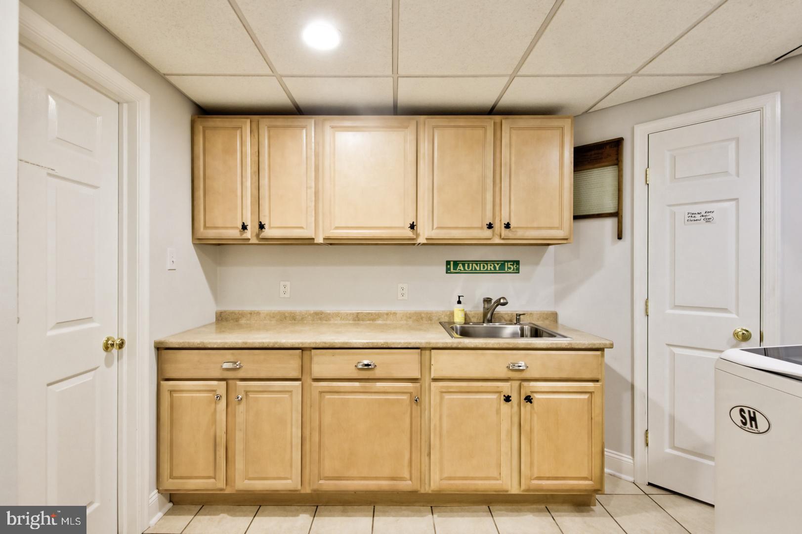 228 South Fairfield Road Devon, PA 19333 - Photo 61 of 61 a kitchen with white cabinets and sink