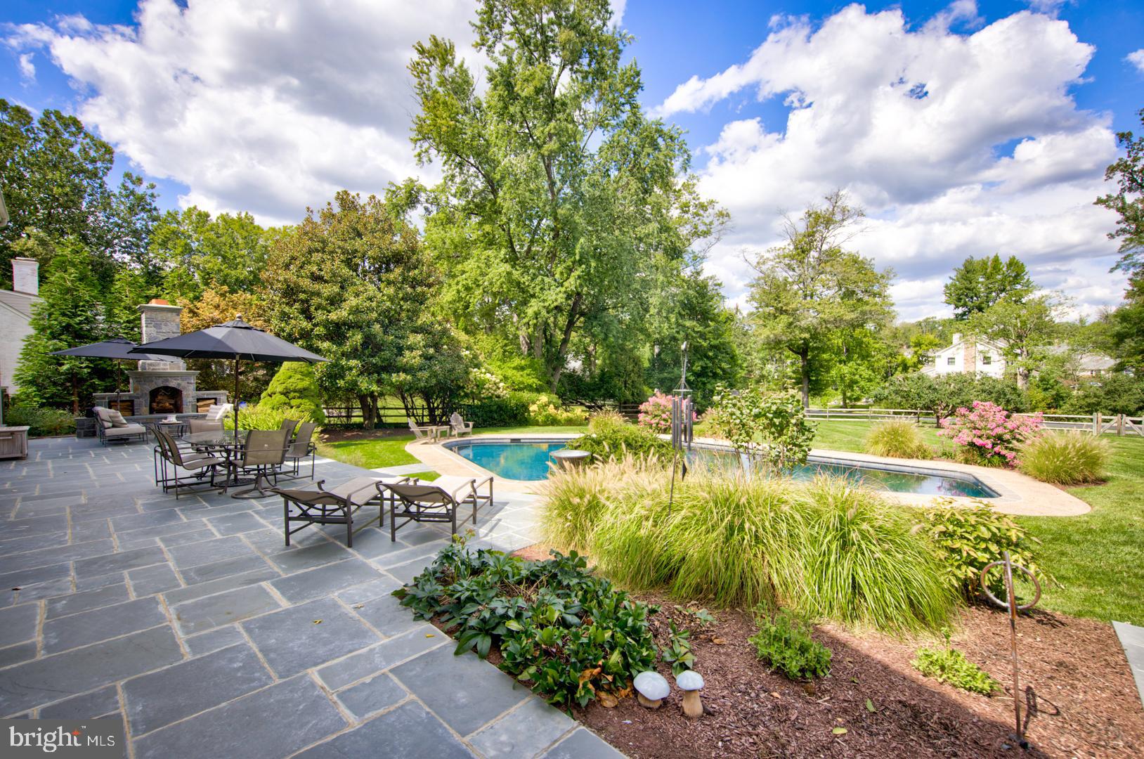 228 South Fairfield Road Devon, PA 19333 - Photo 7 of 61 a view of swimming pool with lawn chairs and plants
