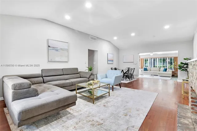 a living room with furniture and a table