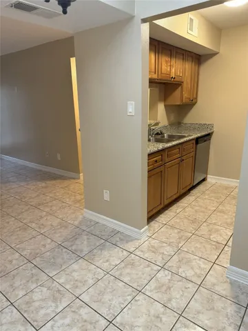 a kitchen with stainless steel appliances a cabinets and a counter top space
