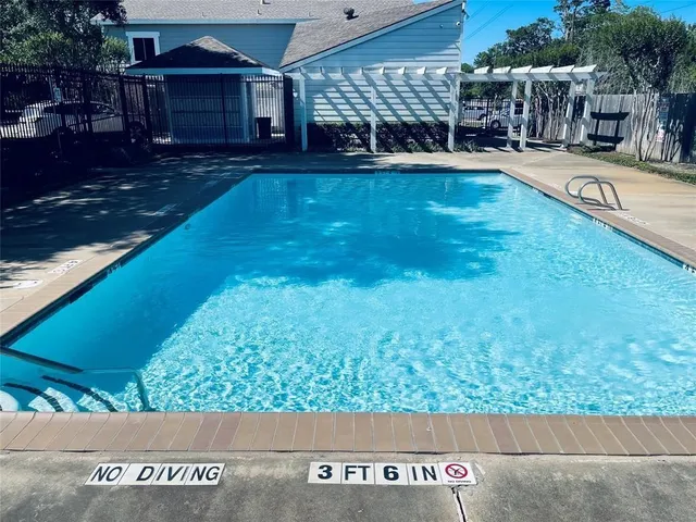 a view of swimming pool with a patio