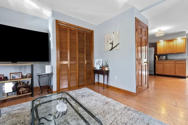 a view of a livingroom with furniture and a flat screen tv
