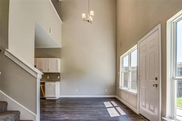 a view of an entryway with wooden floor