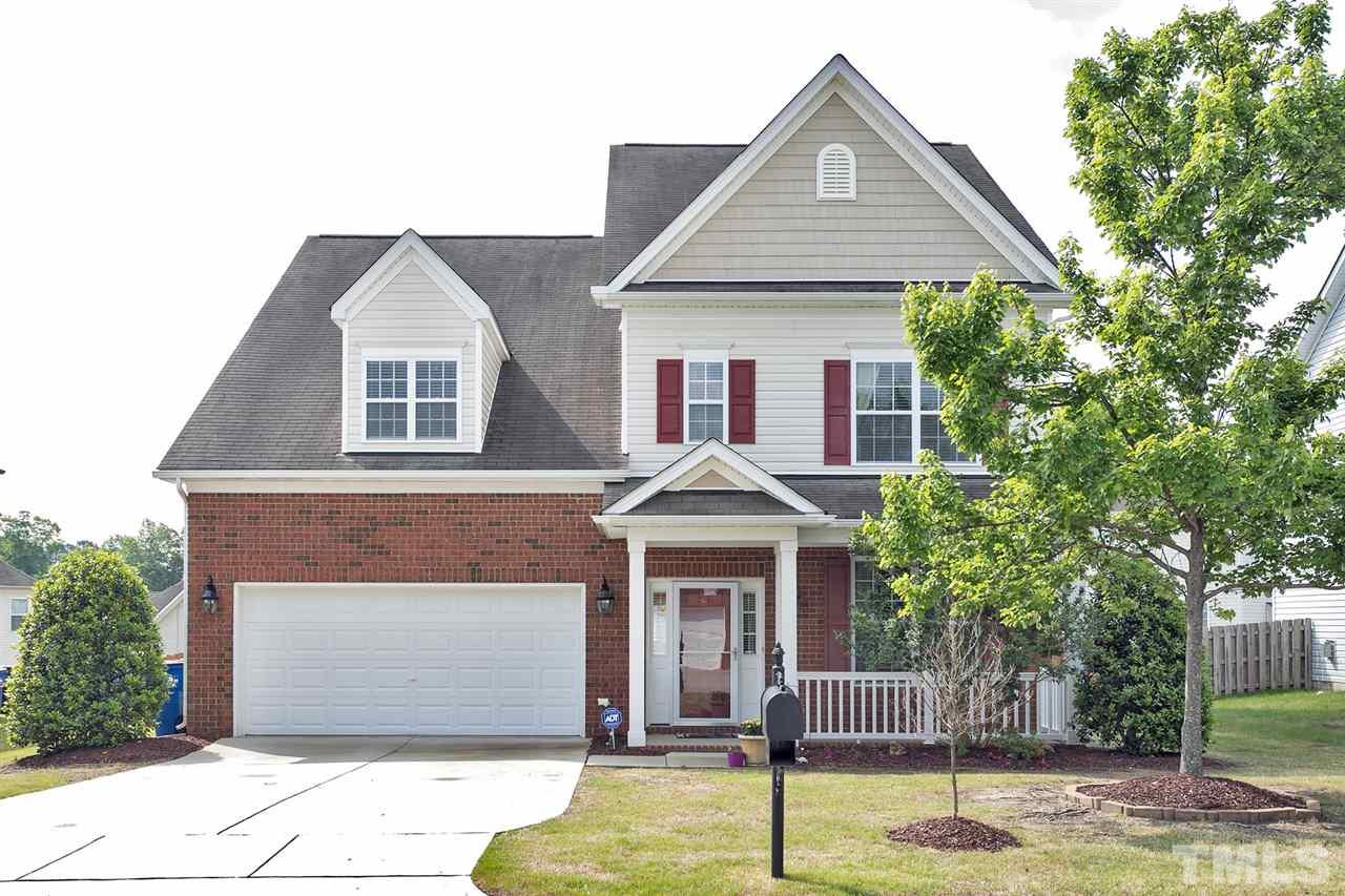 5136 Holly Ridge Farm Road Raleigh, NC 27616 - Photo 1 of 25 a front view of a house with garden