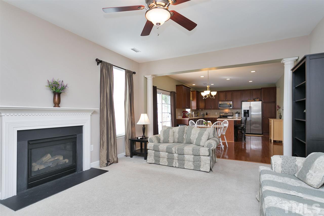 5136 Holly Ridge Farm Road Raleigh, NC 27616 - Photo 12 of 25 a living room with furniture and a fireplace