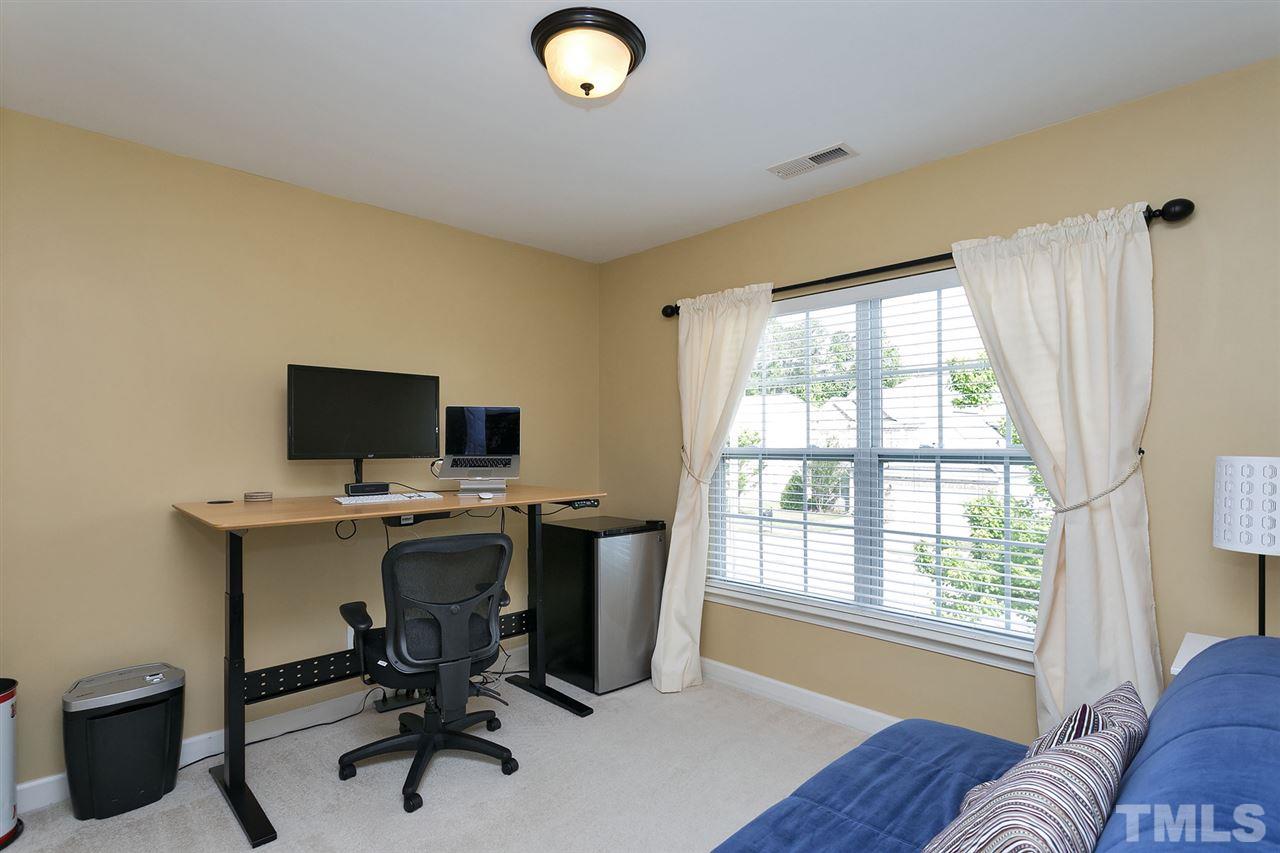 5136 Holly Ridge Farm Road Raleigh, NC 27616 - Photo 15 of 25 a view of a workspace with furniture and a window