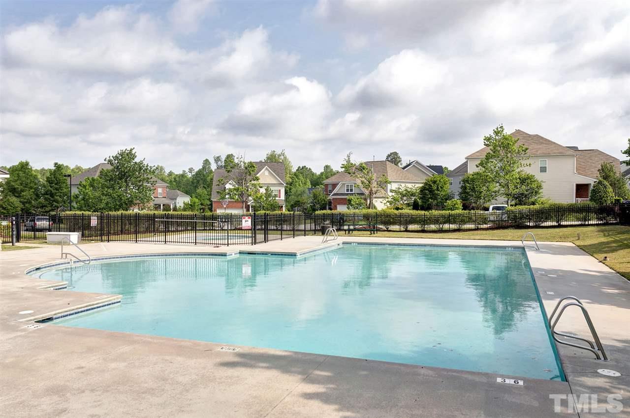 5136 Holly Ridge Farm Road Raleigh, NC 27616 - Photo 25 of 25 a view of swimming pool with outdoor seating and plants