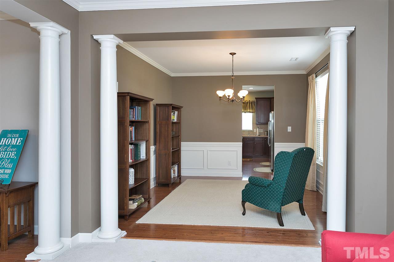 5136 Holly Ridge Farm Road Raleigh, NC 27616 - Photo 8 of 25 a living room with furniture and a chandelier