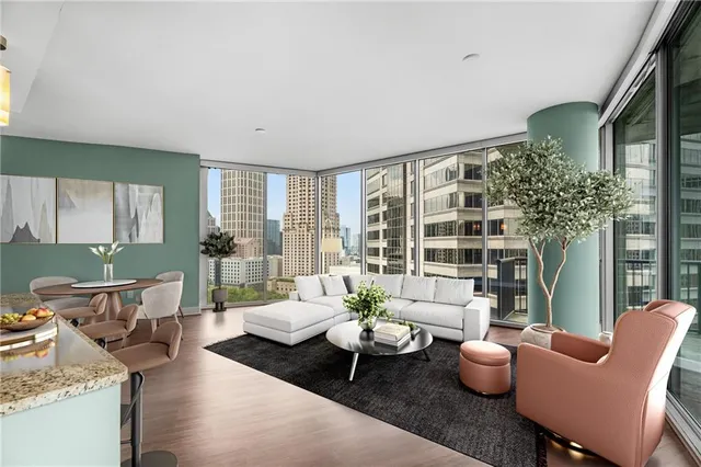 a living room with furniture and a large window