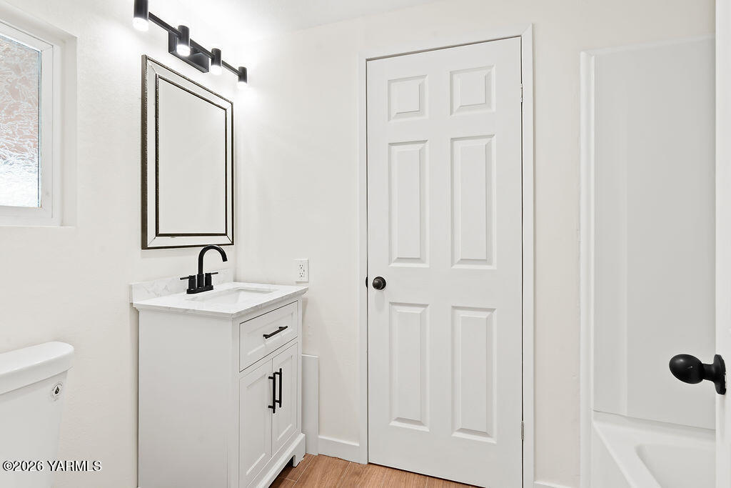3701 Gun Club Road, Unit 45 Yakima, WA 98901 - Photo 15 of 20 a bathroom with a sink a toilet and a mirror