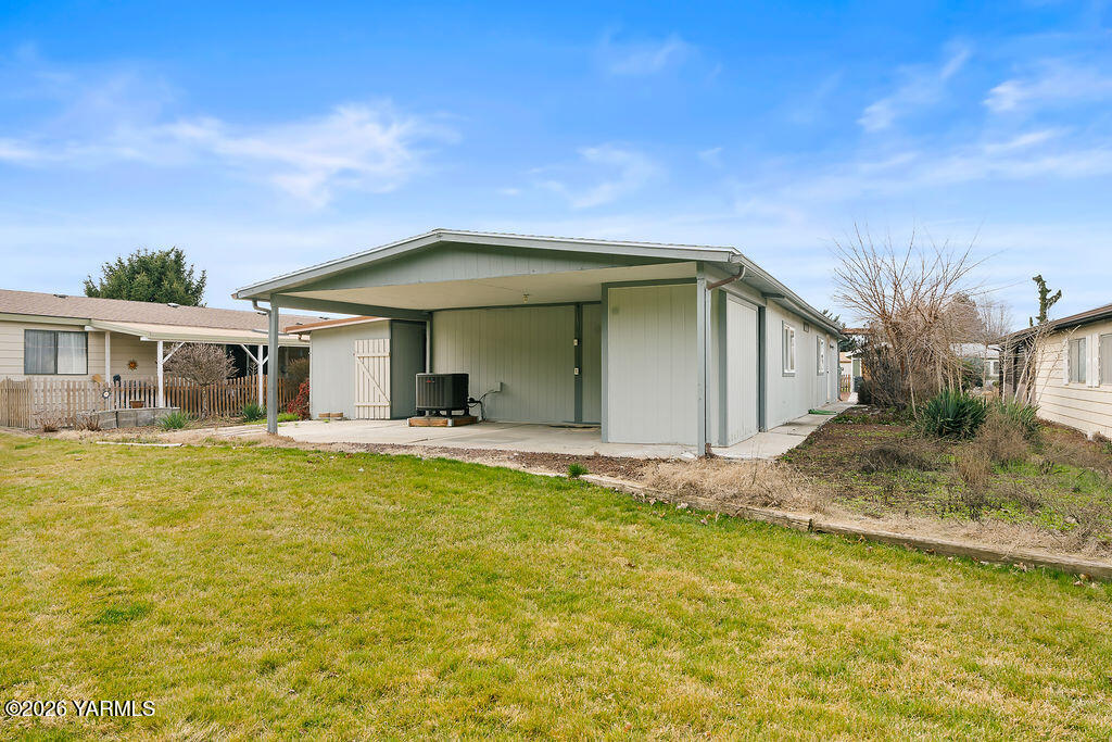 3701 Gun Club Road, Unit 45 Yakima, WA 98901 - Photo 18 of 20 a view of a house with pool and sitting area