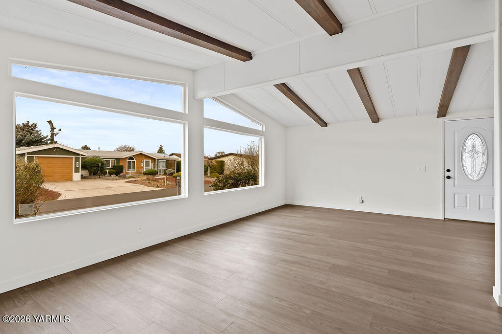 3701 Gun Club Road, Unit 45 Yakima, WA 98901 - Photo 10 of 20 a view of an empty room with wooden floor and a window