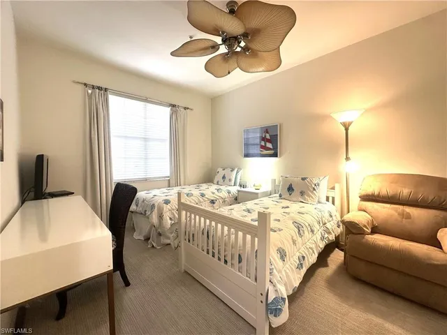 a view of swimming pool and trees in the background