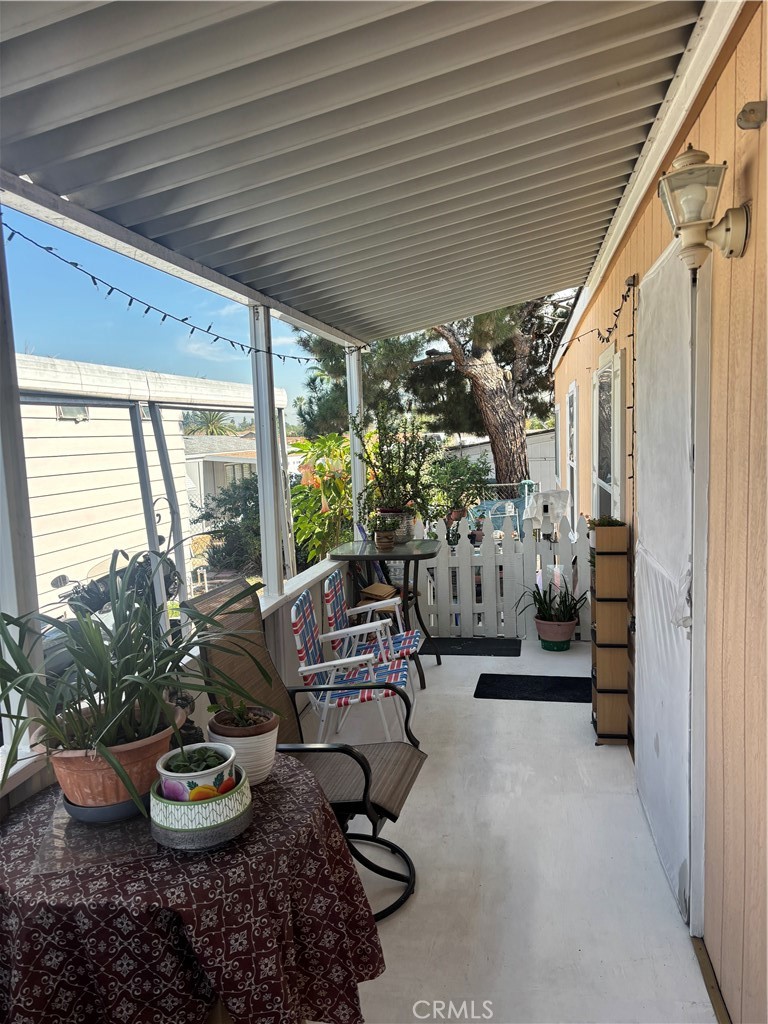 8389 Baker Avenue, Unit 82 Rancho Cucamonga, CA 91730 - Photo 12 of 13 a living room with furniture and a potted plant