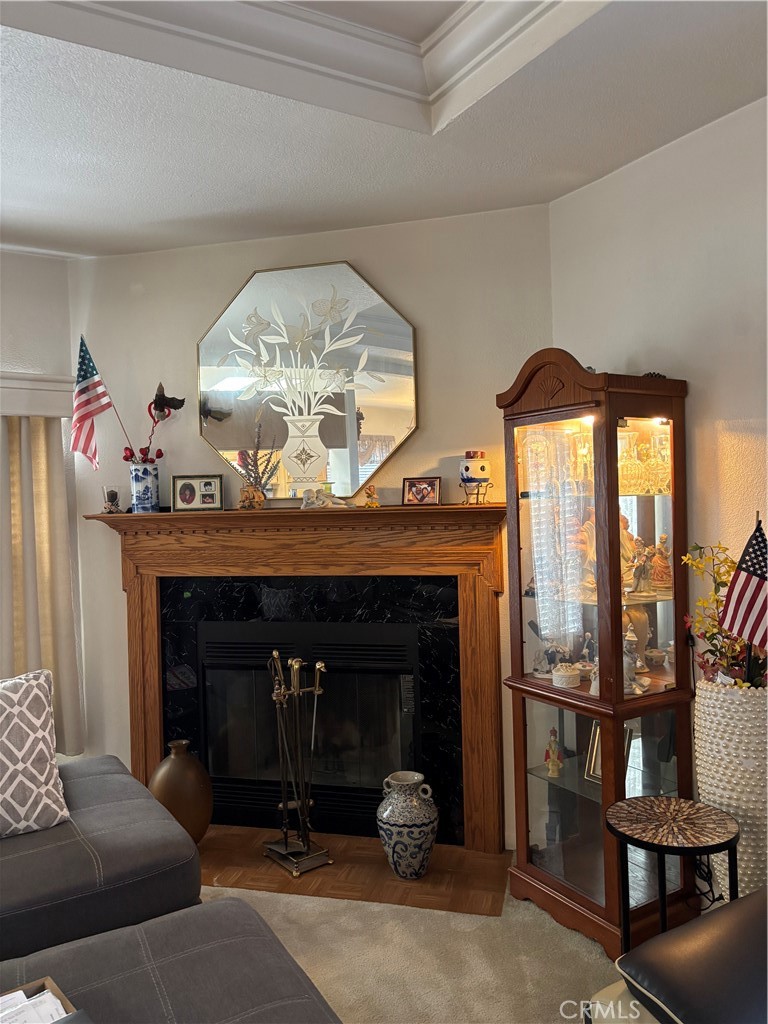 8389 Baker Avenue, Unit 82 Rancho Cucamonga, CA 91730 - Photo 3 of 13 a living room with furniture and a fireplace