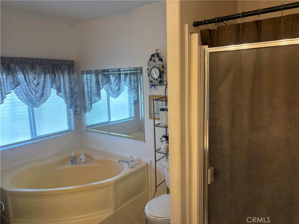 8389 Baker Avenue, Unit 82 Rancho Cucamonga, CA 91730 - Photo 9 of 13 a bathroom with a sink and a tub