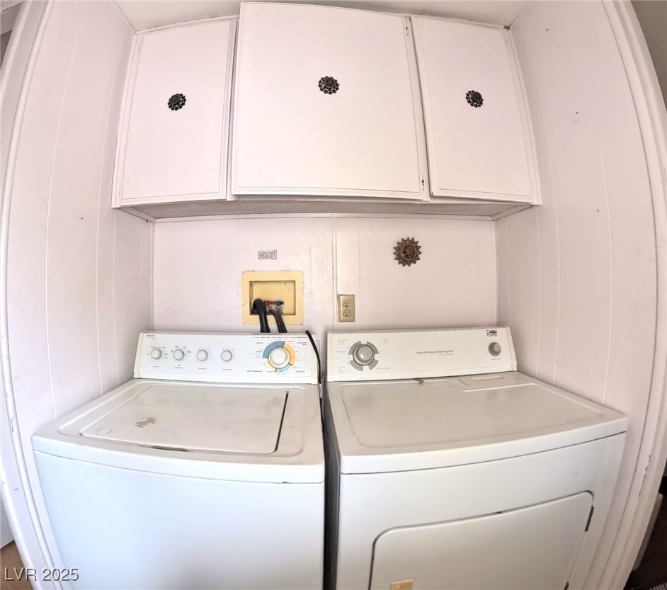 80 Russell Road Pahrump, NV 89048 - Photo 16 of 20 Laundry area featuring cabinet space and washing machine and clothes dryer