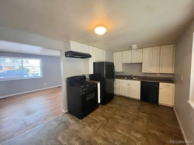 8950 Ithaca Way Westminster, CO 80031 - Photo 4 of 13 a kitchen with granite countertop a refrigerator stove top oven and sink