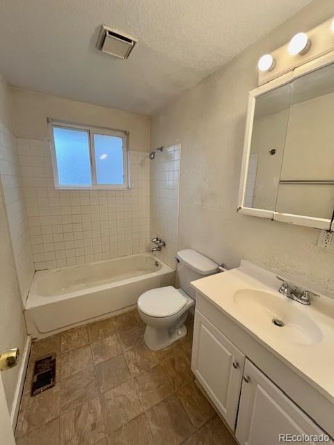 8950 Ithaca Way Westminster, CO 80031 - Photo 7 of 13 a bathroom with a sink a bathtub a mirror a toilet a sink and vanity