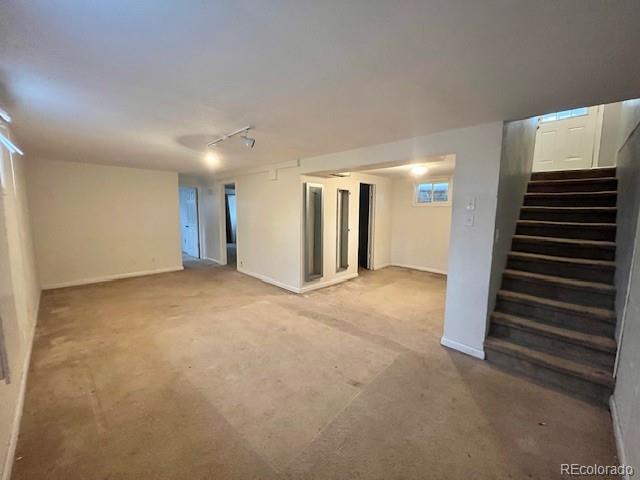 8950 Ithaca Way Westminster, CO 80031 - Photo 8 of 13 a view of an empty room with wooden floor