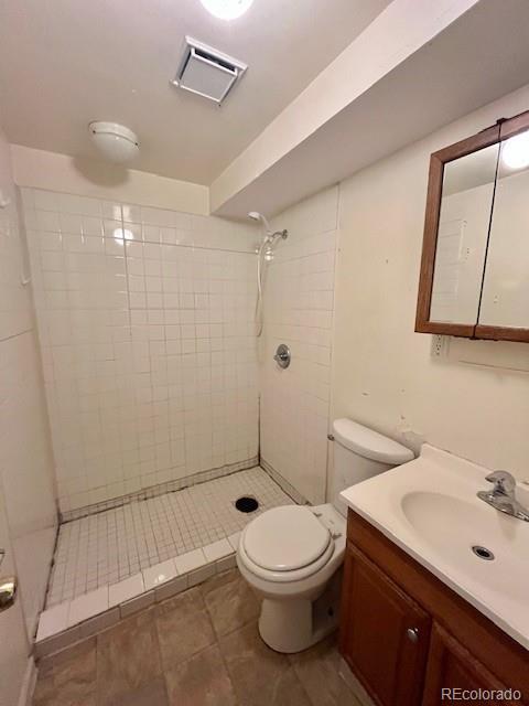 8950 Ithaca Way Westminster, CO 80031 - Photo 9 of 13 a bathroom with a toilet sink and shower