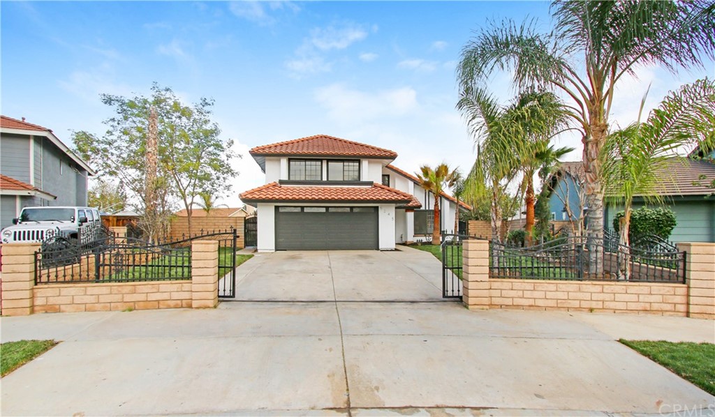 5245 Hallmark Street Riverside, CA 92505 - Photo 1 of 1 a front view of a house with a garden