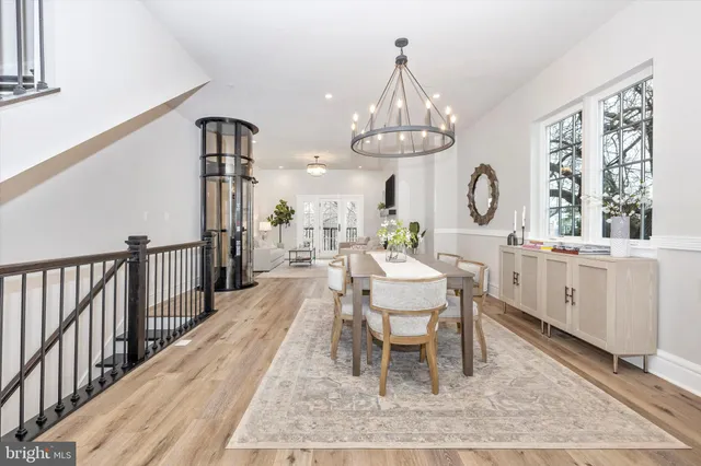 a kitchen with stainless steel appliances granite countertop a sink and wooden cabinets