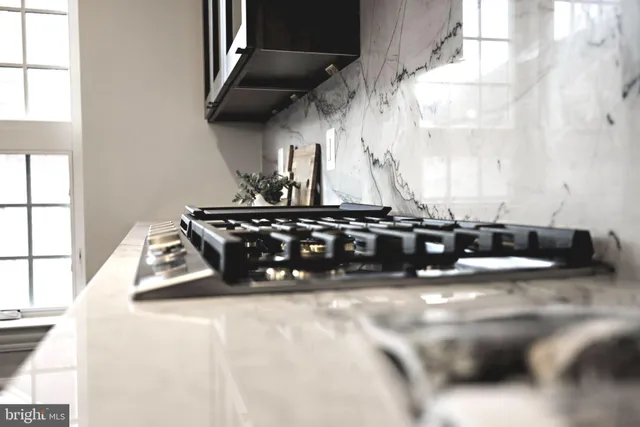 a room with a sink and a mirror