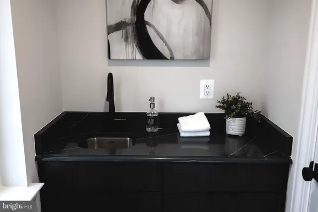 a view of a living room kitchen and a floor to ceiling window