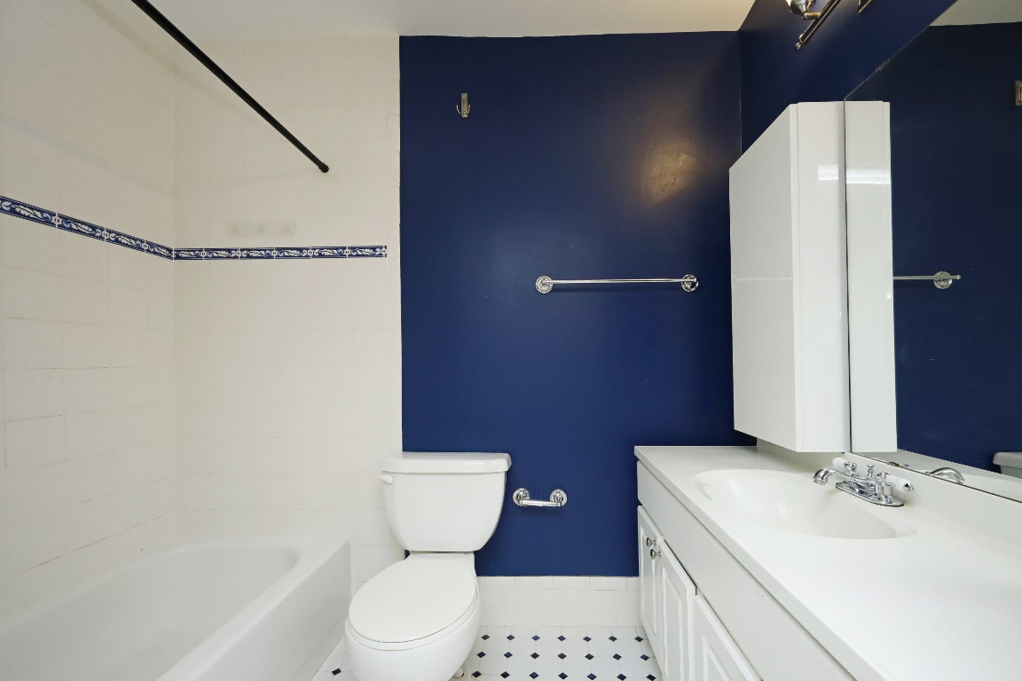 Undisclosed Address Raleigh, NC 27605 - Photo 12 of 38 a bathroom with a sink a toilet and shower