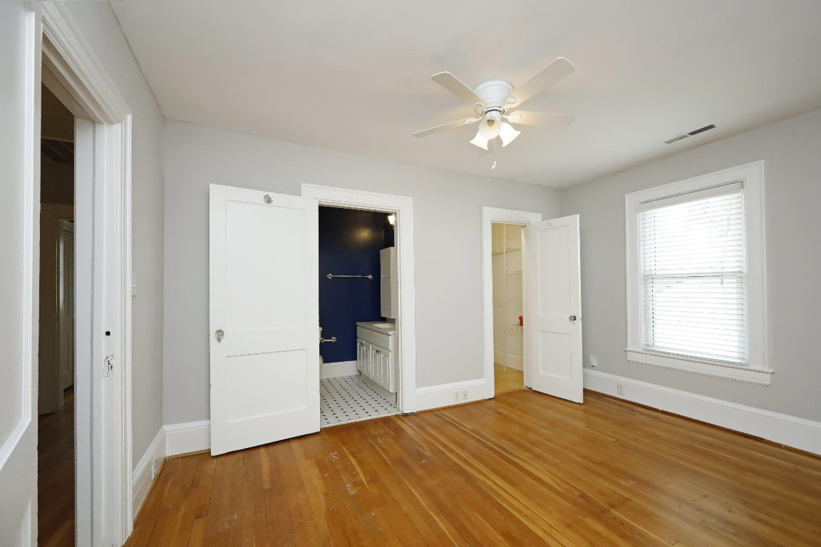 Undisclosed Address Raleigh, NC 27605 - Photo 17 of 38 a view of empty room with wooden floor and fan