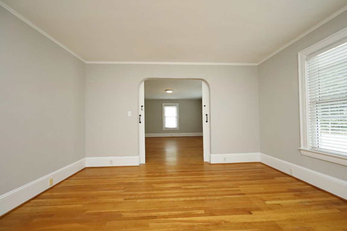 Undisclosed Address Raleigh, NC 27605 - Photo 24 of 38 a view of empty room with wooden floor and fan
