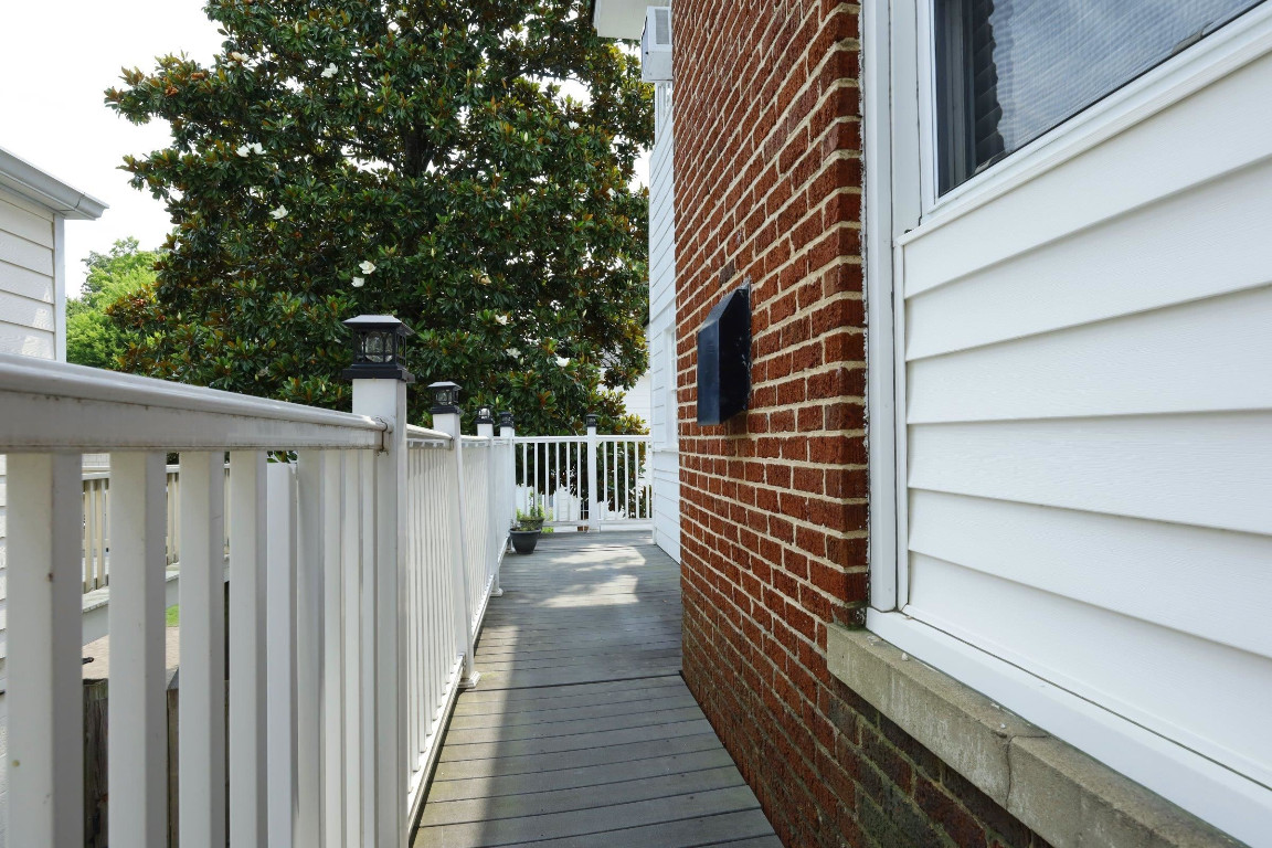 Undisclosed Address Raleigh, NC 27605 - Photo 32 of 38 a view of stairs and wooden floor