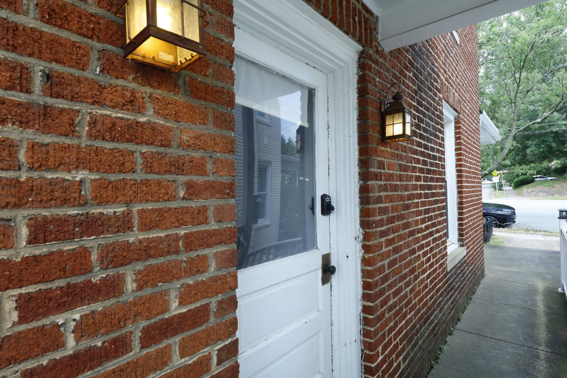 Undisclosed Address Raleigh, NC 27605 - Photo 33 of 38 a view of a door and a wooden door