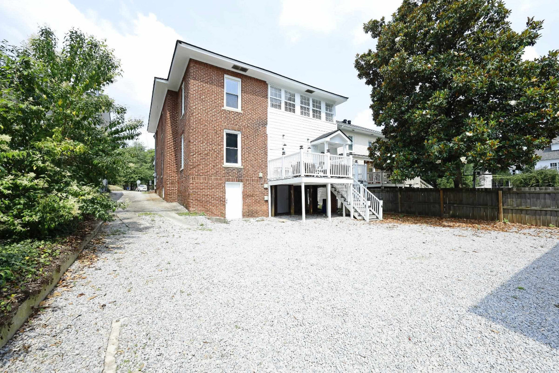 Undisclosed Address Raleigh, NC 27605 - Photo 34 of 38 a front view of a house with a yard