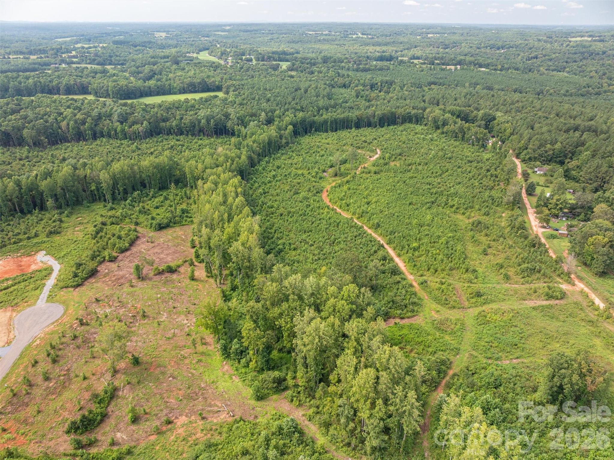 0 Westwinds Road, Unit F3 Lincolnton, NC 28092 - Photo 12 of 14 a view of a big yard with lots of green space and mountain view in back