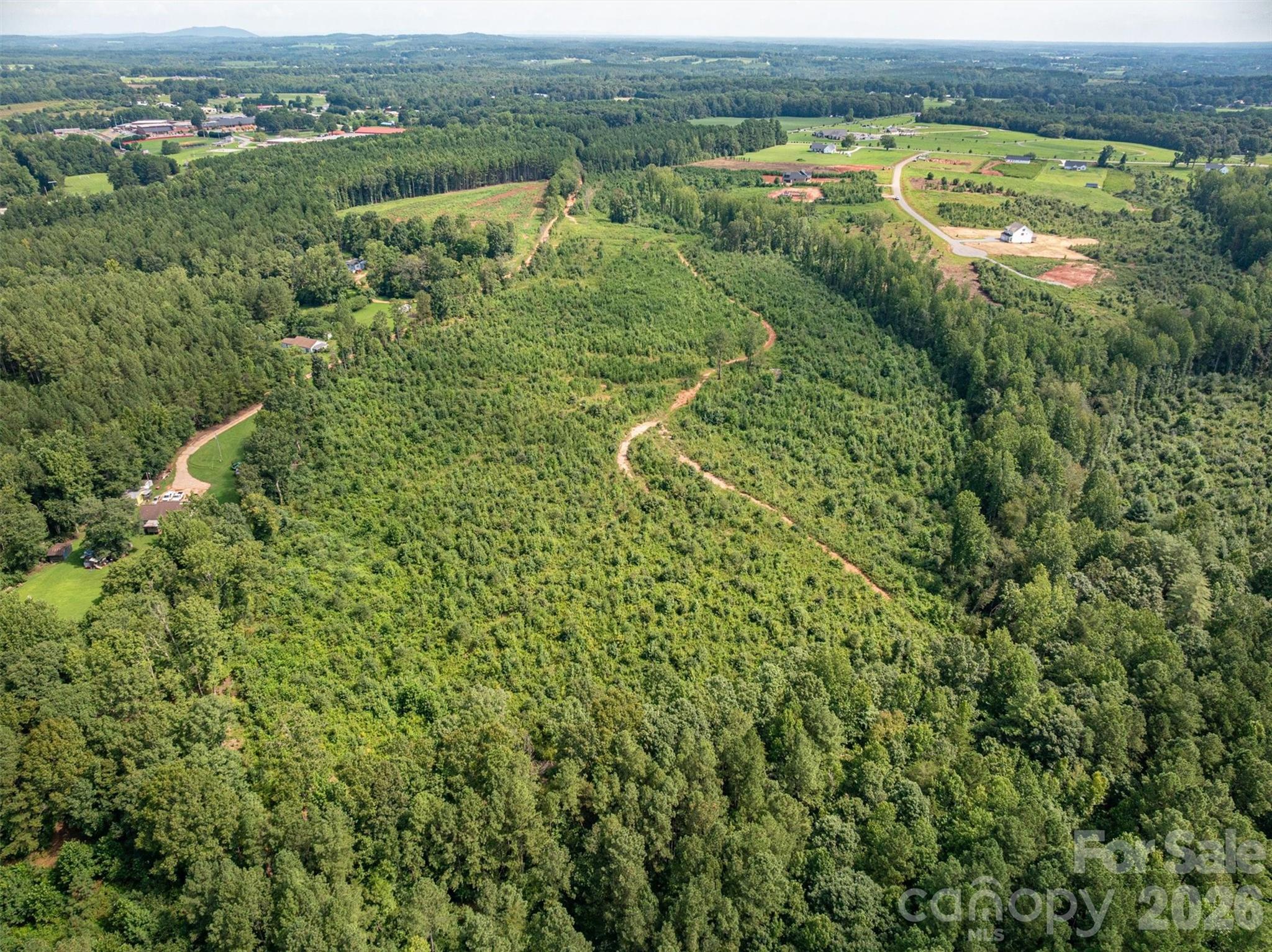 0 Westwinds Road, Unit F3 Lincolnton, NC 28092 - Photo 2 of 14 an aerial view of residential houses with outdoor space and trees