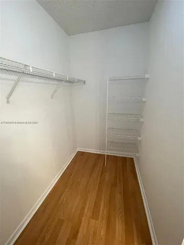 a view of an empty walk in closet
