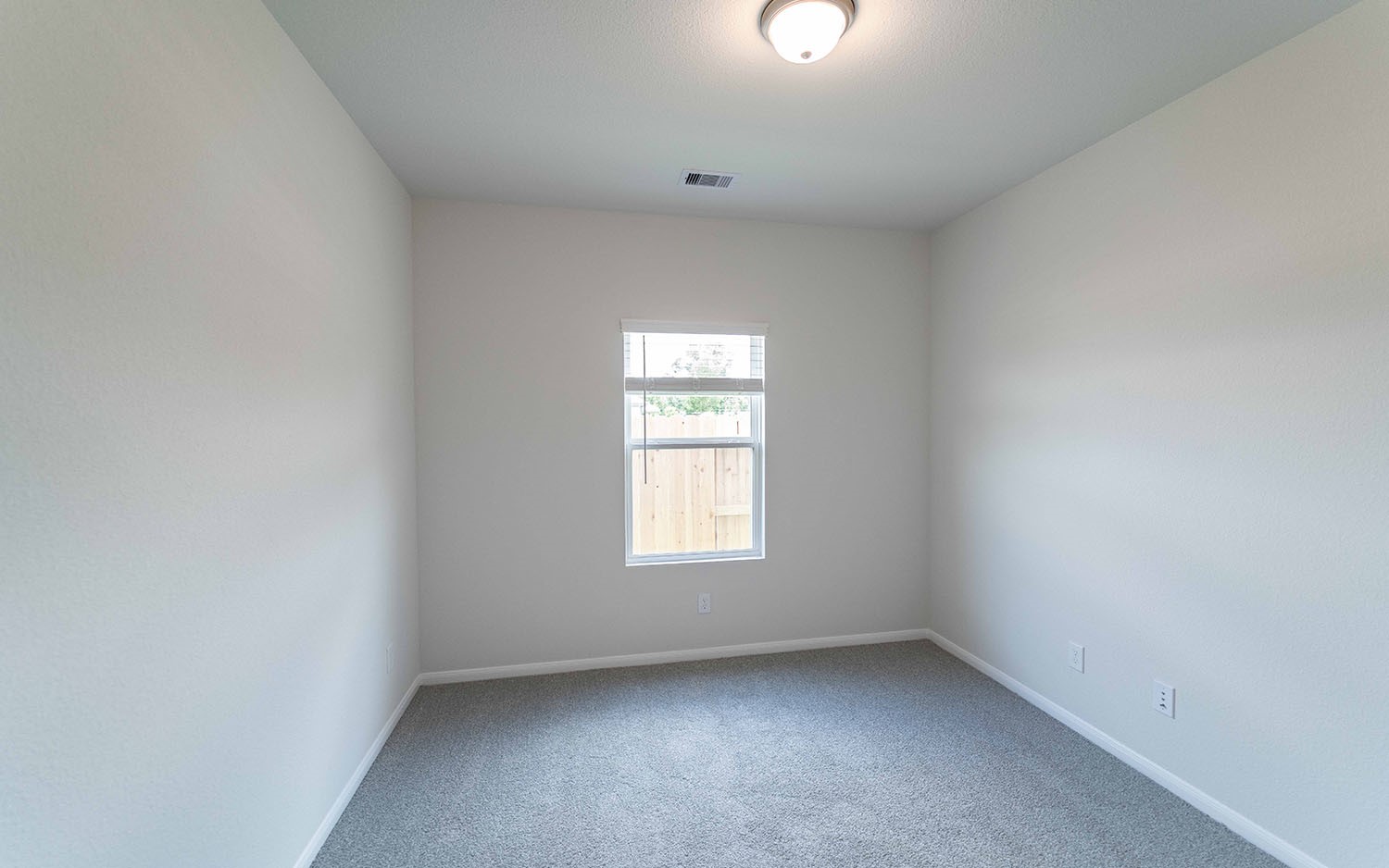 4326 Maple Root Lane Pinehurst, TX 77362 - Photo 4 of 19 an empty room with a window