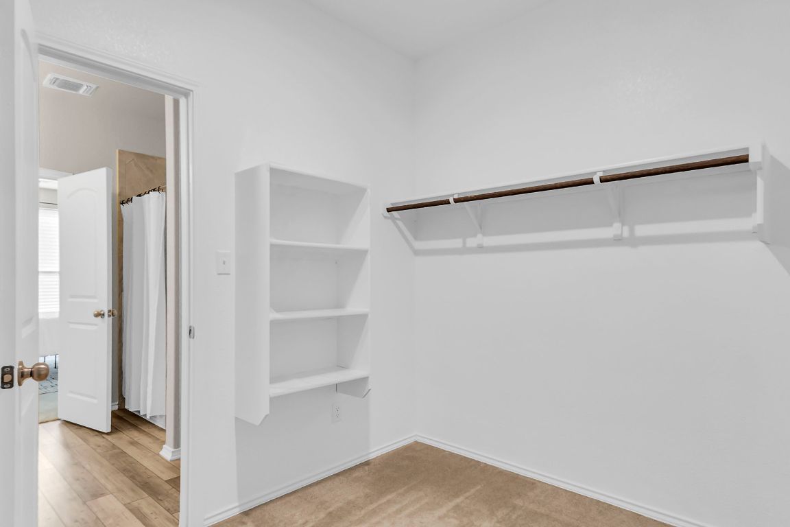 112 Black Alder Street Georgetown, TX 78626 - Photo 14 of 37 a view of an empty walk in closet