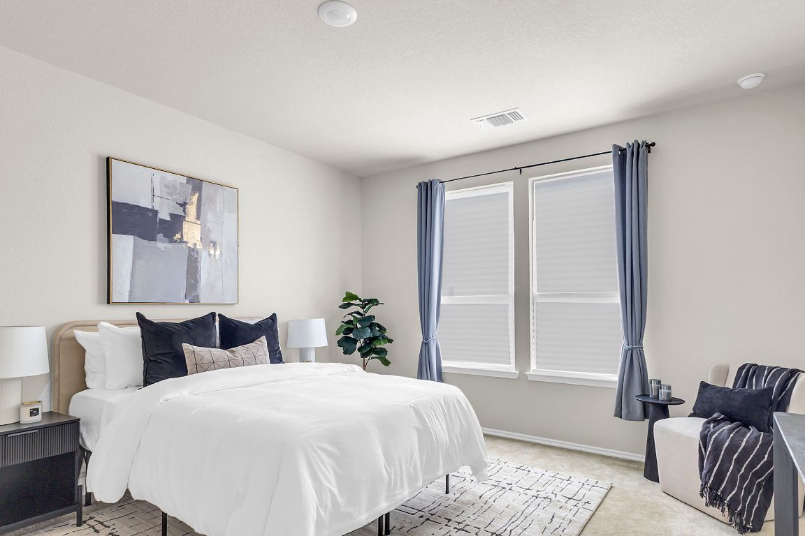 112 Black Alder Street Georgetown, TX 78626 - Photo 17 of 37 a bedroom with a bed and wooden floor