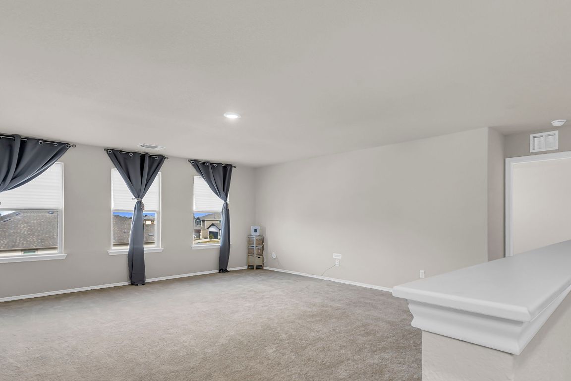 112 Black Alder Street Georgetown, TX 78626 - Photo 19 of 37 an empty room with windows