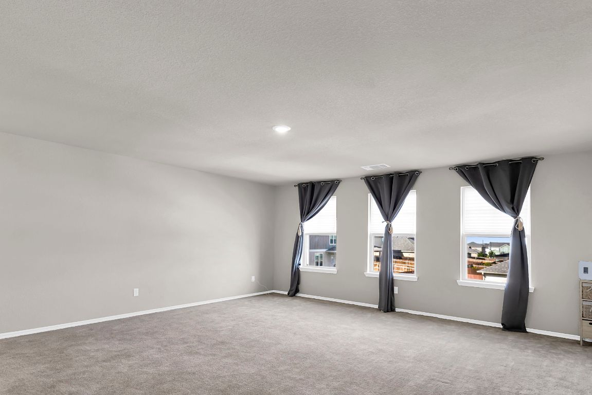 112 Black Alder Street Georgetown, TX 78626 - Photo 20 of 37 an empty room with windows and white walls