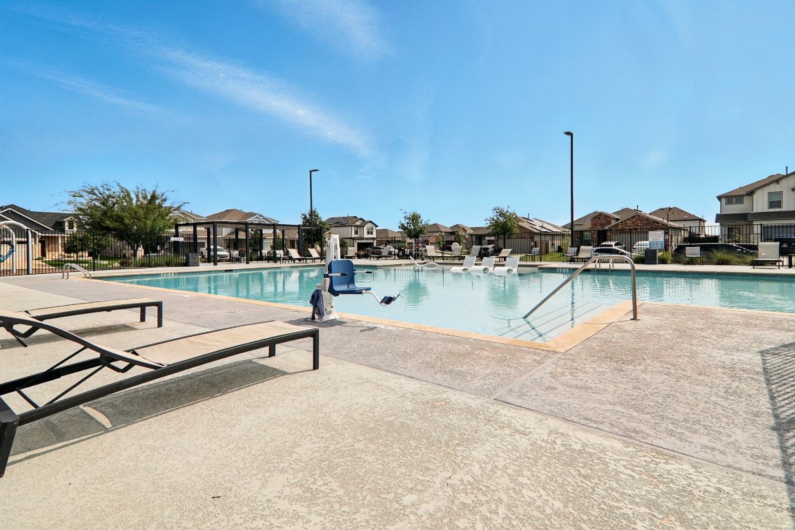 112 Black Alder Street Georgetown, TX 78626 - Photo 32 of 37 a view of a lake with a table and chairs