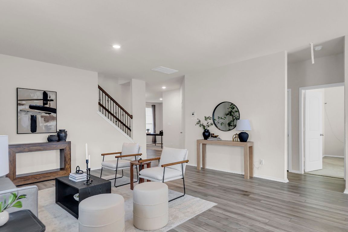 112 Black Alder Street Georgetown, TX 78626 - Photo 7 of 37 a living room with furniture a table and wooden floor