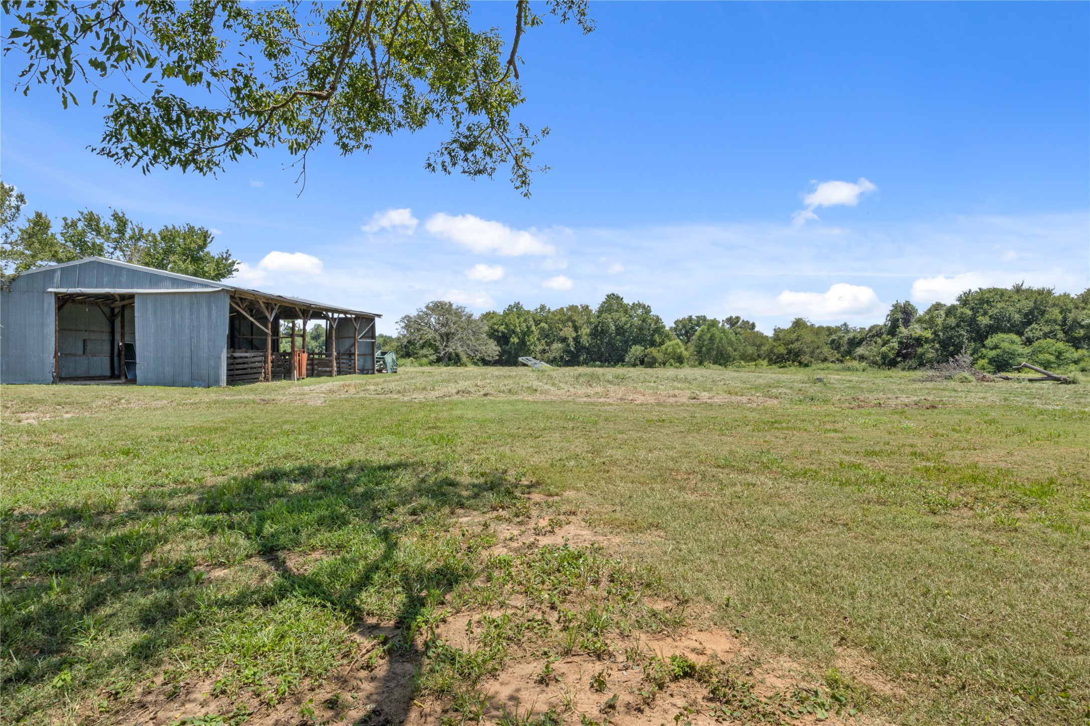 451 Pleasant Grove Road Elgin, TX 78621 - Photo 22 of 32 a view of a house with a big yard